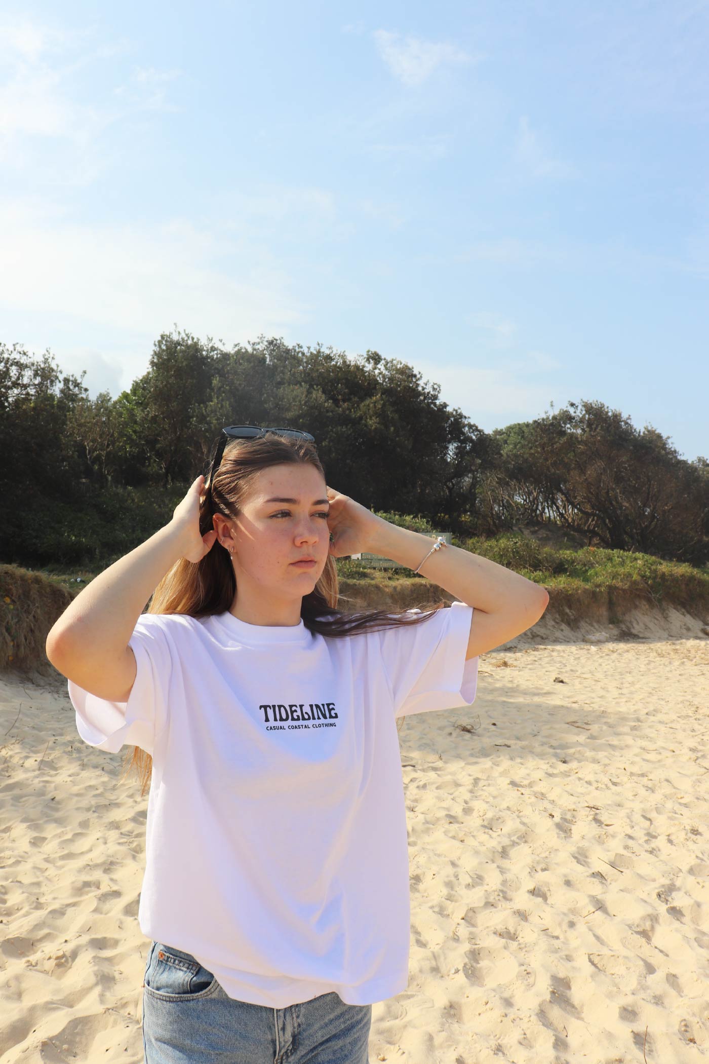 Female model wearing coastal Surf Van Graphic T-Shirt front view white t shirt