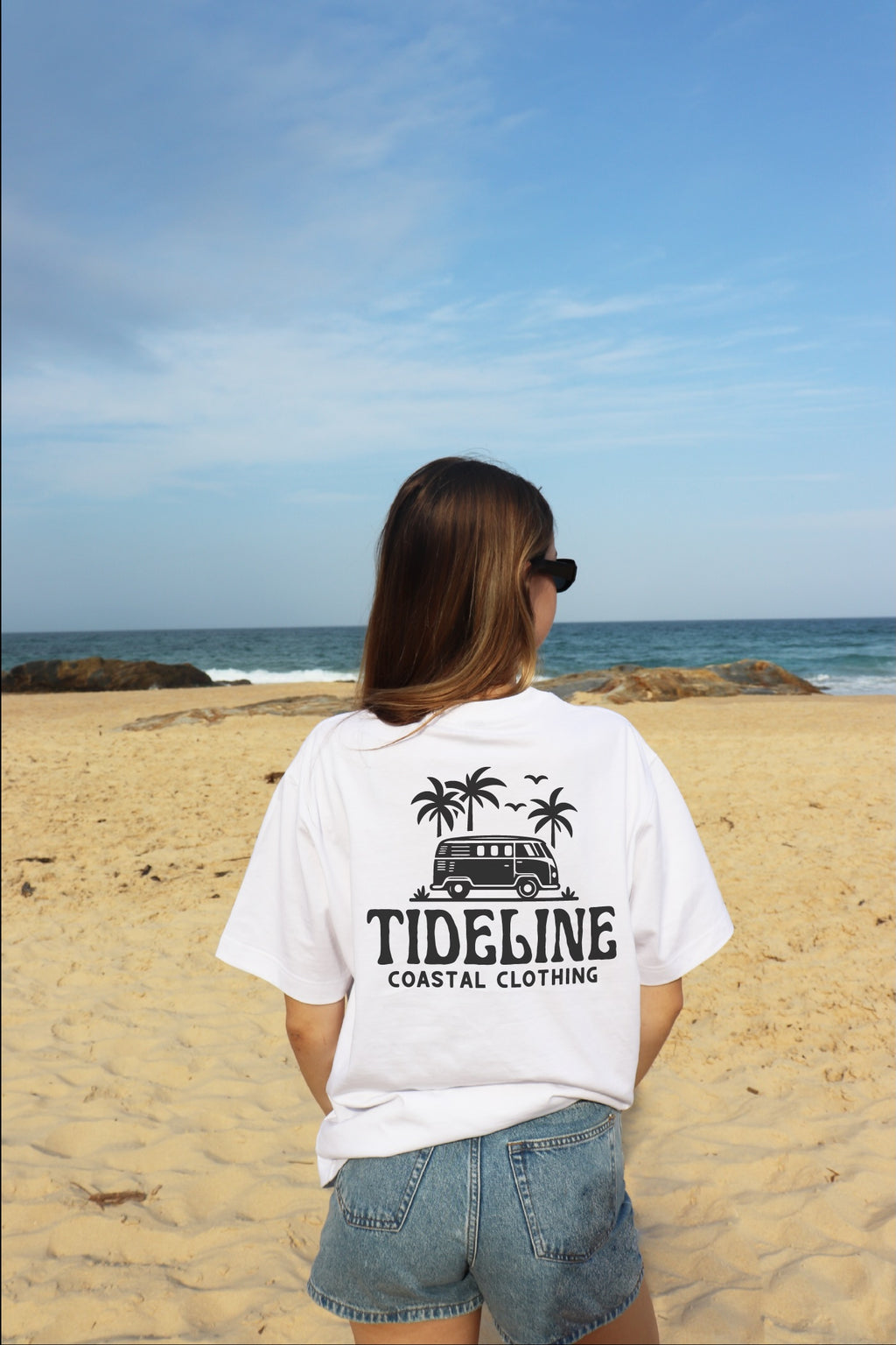 Female model wearing coastal Surf Van Graphic T-Shirt back view white t shirt